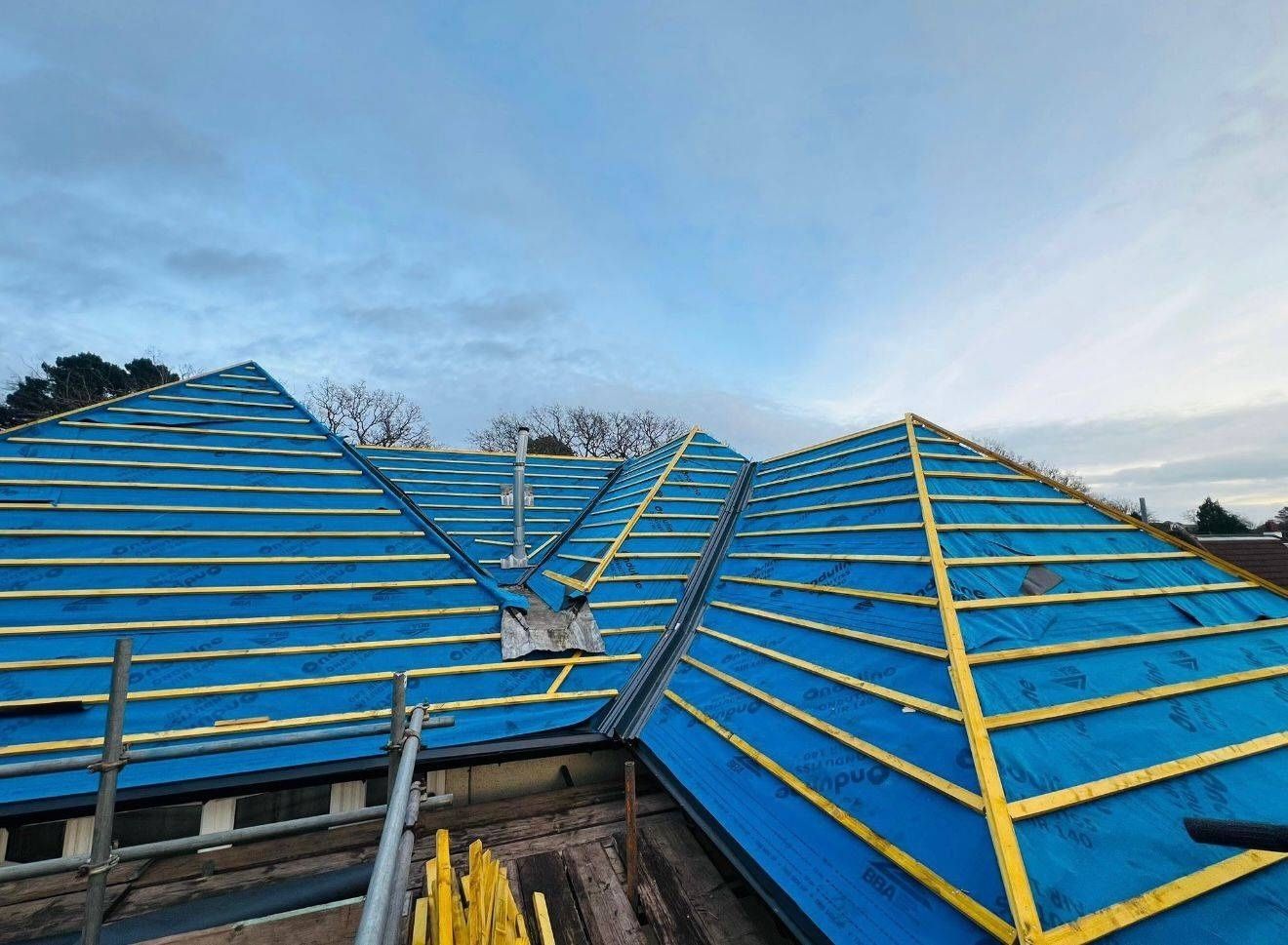 New treated battens being fixed over breathable membrane on a Canterbury hipped roof