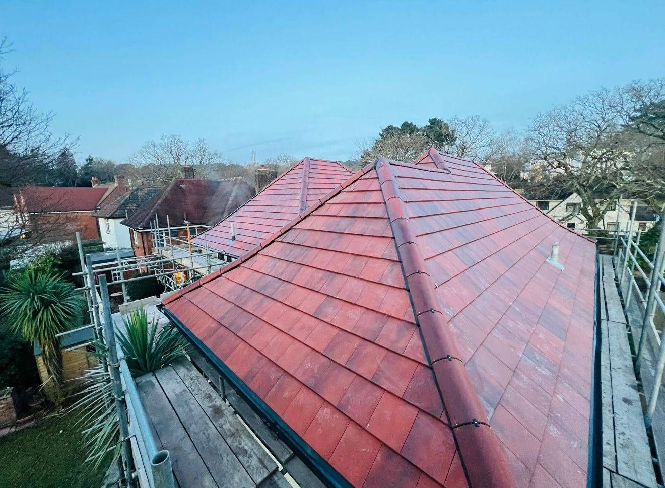 Dry ridge system along the ridge line of a red clay tiled roof in Canterbury