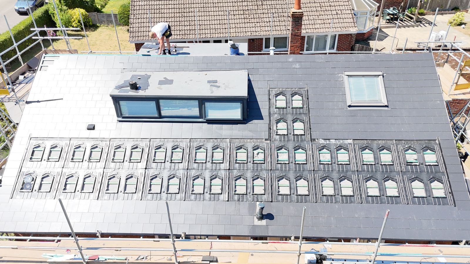 Roof fully slated around in-roof solar trays, Canterbury