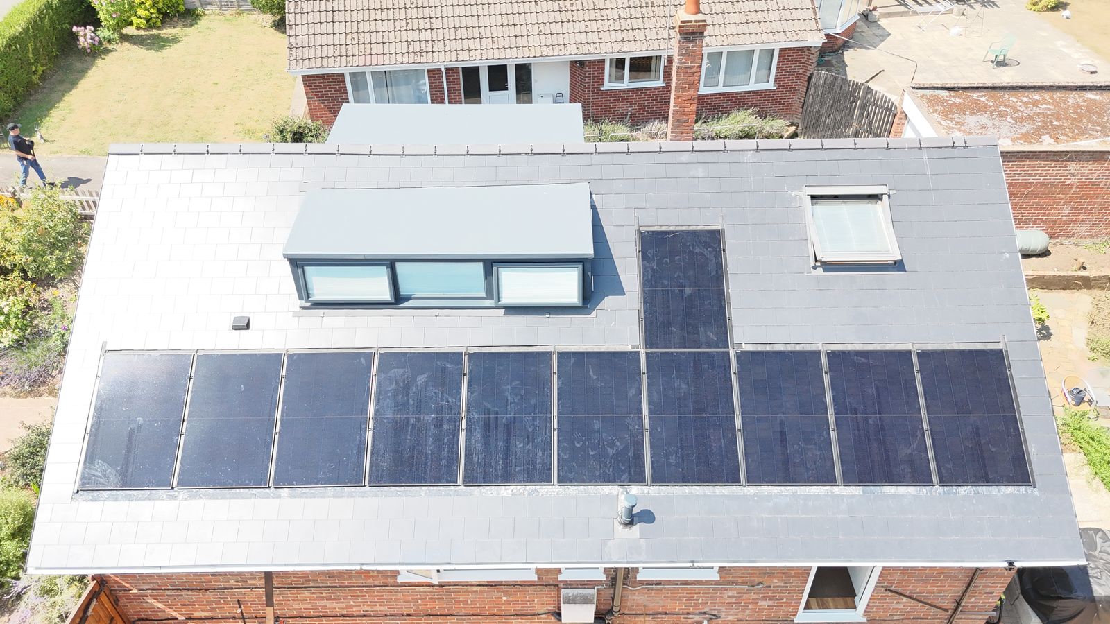 Finished roof with in-roof solar panels and dormer, scaffold removed, Canterbury